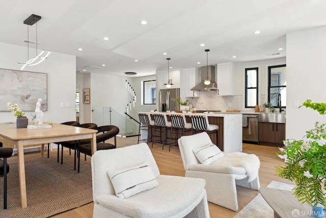 867 33rd Ave, San Francisco, CA 94121 - living area with stairway, light wood-type flooring, and recessed lighting