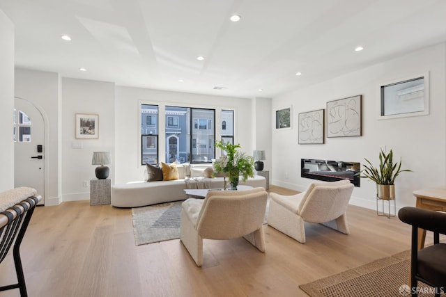 867 33rd Ave, San Francisco, CA 94121 - living room featuring light wood finished floors, recessed lighting, baseboards, and arched walkways