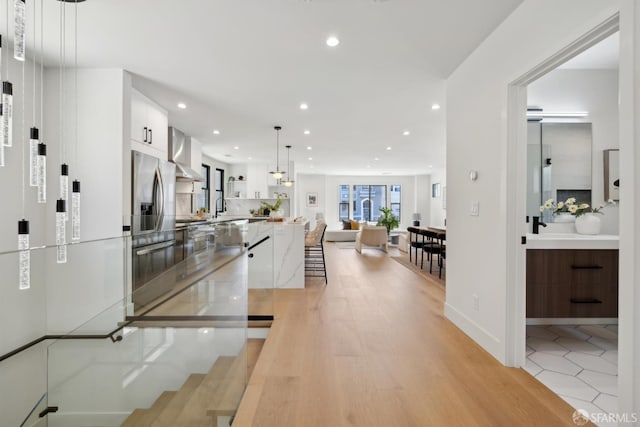 867 33rd Ave, San Francisco, CA 94121 - hall with recessed lighting, a sink, and light wood-style floors
