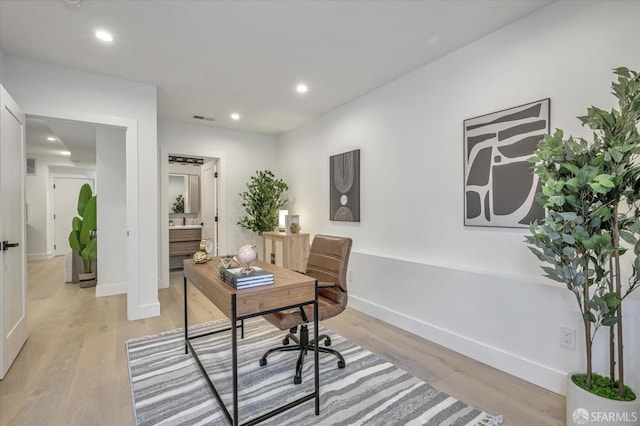 office space featuring light hardwood / wood-style floors