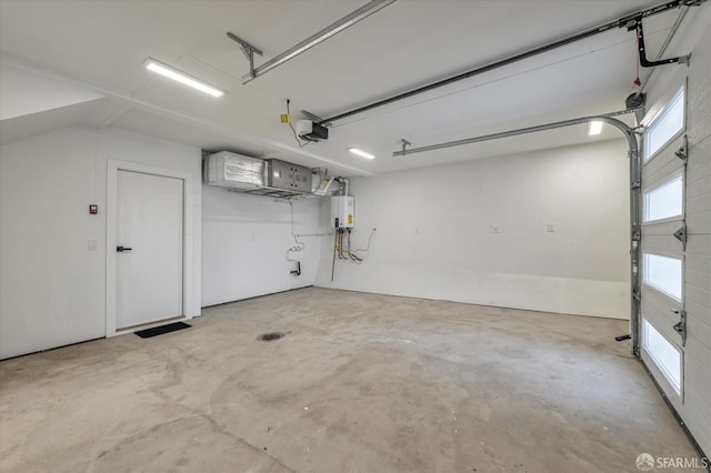 garage with water heater and a garage door opener