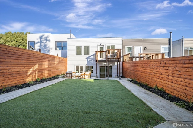 rear view of property with a patio area and a yard