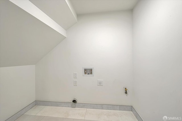 laundry area featuring light tile patterned floors, electric dryer hookup, gas dryer hookup, and hookup for a washing machine