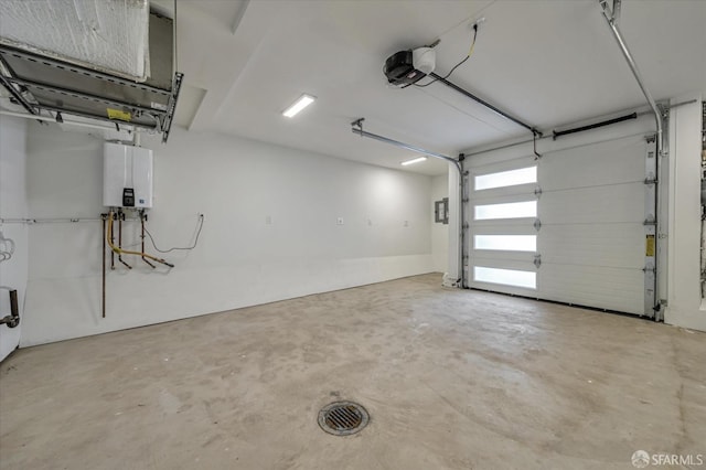 garage featuring tankless water heater and a garage door opener