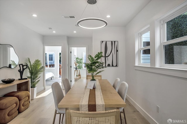 dining area featuring light wood-type flooring