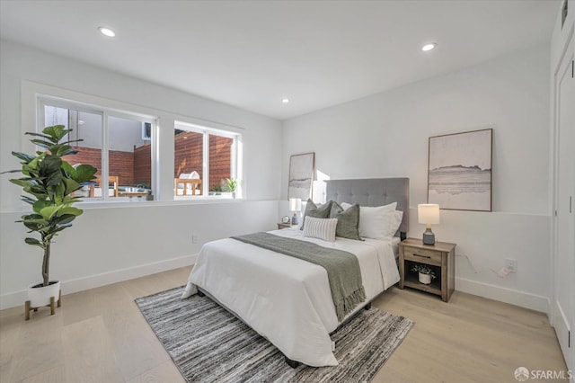 bedroom with light hardwood / wood-style floors