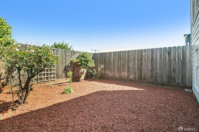 view of yard with a fenced backyard