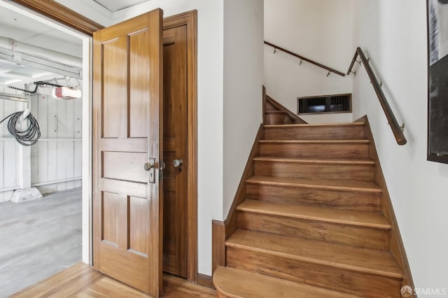 stairway featuring visible vents