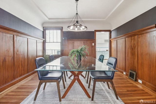 dining area featuring visible vents and light wood-type flooring