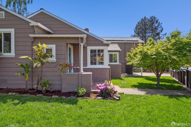 4600 Steele St, Oakland, CA 94619 - view of front of property with solar panels, a chimney, and brick siding