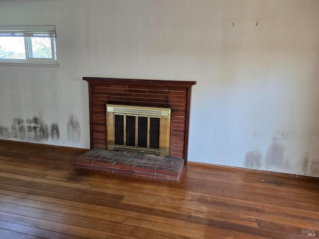 room details featuring wood finished floors and a fireplace