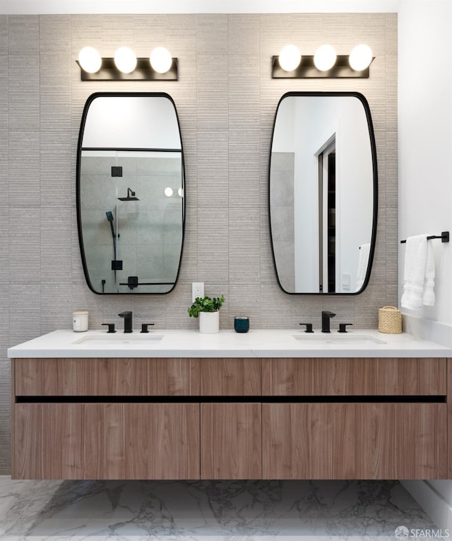 bathroom with vanity and tile walls