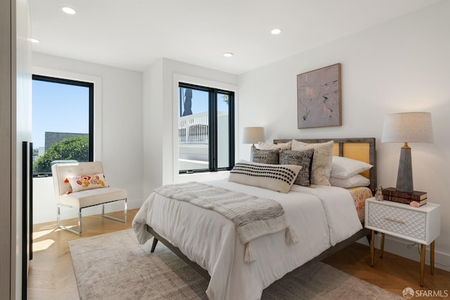 bedroom featuring light parquet flooring