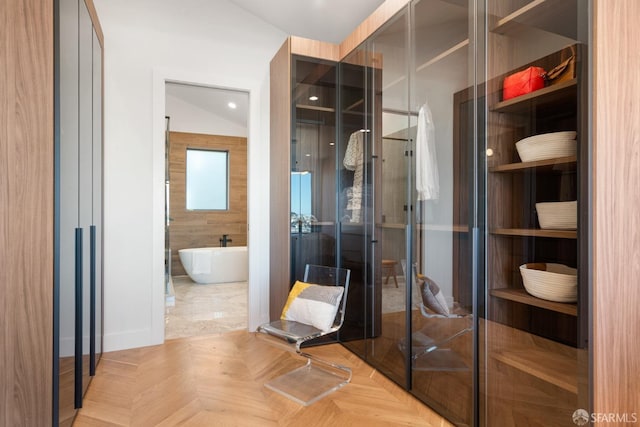 bathroom with parquet flooring and plus walk in shower