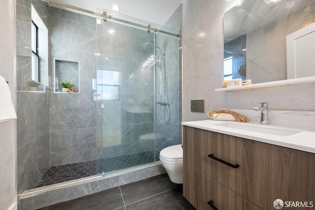 2219 Bryant St, San Francisco, CA 94110 - bathroom with a shower with door, toilet, tile patterned flooring, and vanity