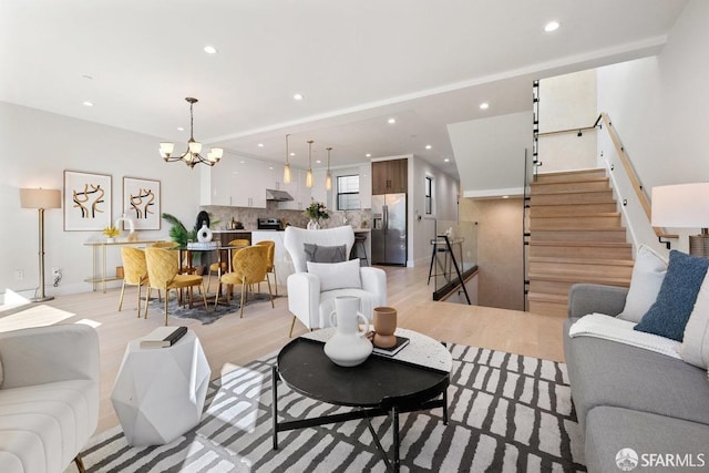 2219 Bryant St, San Francisco, CA 94110 - living room featuring light hardwood / wood-style floors and an inviting chandelier