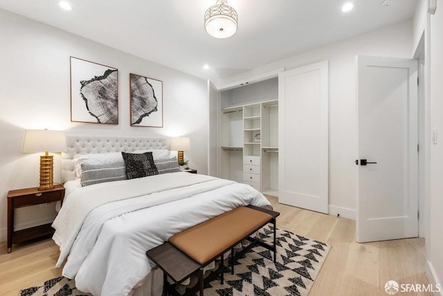 2219 Bryant St, San Francisco, CA 94110 - bedroom featuring a closet, light hardwood / wood-style flooring, and a spacious closet