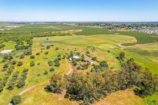 birds eye view of property with a rural view