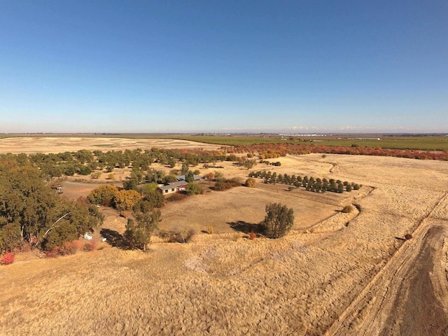 birds eye view of property featuring a rural view