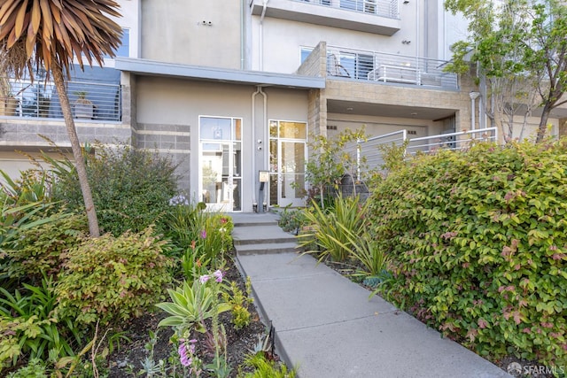 608 Missouri St Unit A, San Francisco, CA 94107 - view of exterior entry with stucco siding, stone siding, and a balcony