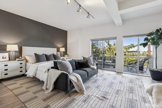 608 Missouri St Unit A, San Francisco, CA 94107 - bedroom with access to exterior, track lighting, light wood-style floors, and beamed ceiling