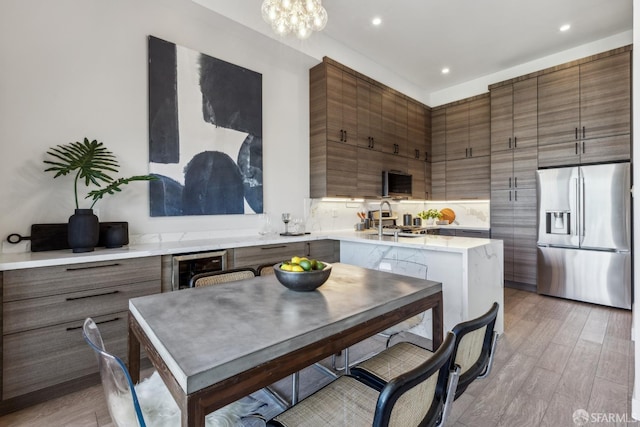 608 Missouri St Unit A, San Francisco, CA 94107 - kitchen with stainless steel fridge with ice dispenser, a sink, light countertops, beverage cooler, and recessed lighting