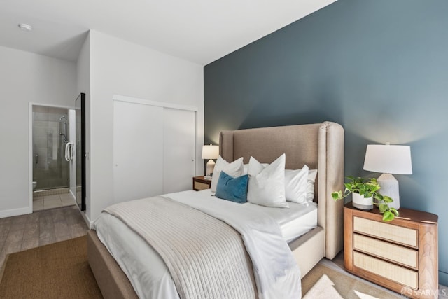 608 Missouri St Unit A, San Francisco, CA 94107 - bedroom with wood finished floors, connected bathroom, a closet, and baseboards