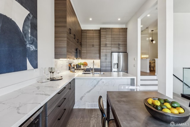 608 Missouri St Unit A, San Francisco, CA 94107 - kitchen featuring stainless steel refrigerator with ice dispenser, a sink, modern cabinets, dark wood-type flooring, and recessed lighting