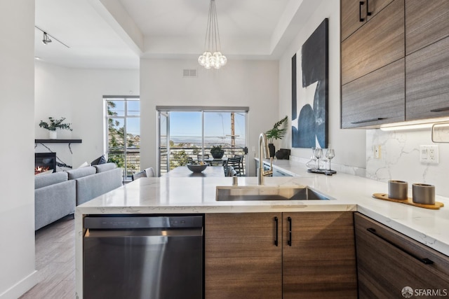 608 Missouri St Unit A, San Francisco, CA 94107 - kitchen with dishwasher, a sink, a peninsula, open floor plan, and light stone countertops