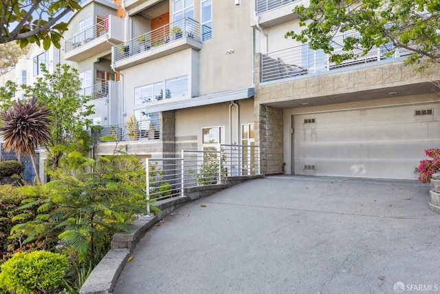 608 Missouri St Unit A, San Francisco, CA 94107 - view of building exterior with concrete driveway and an attached garage