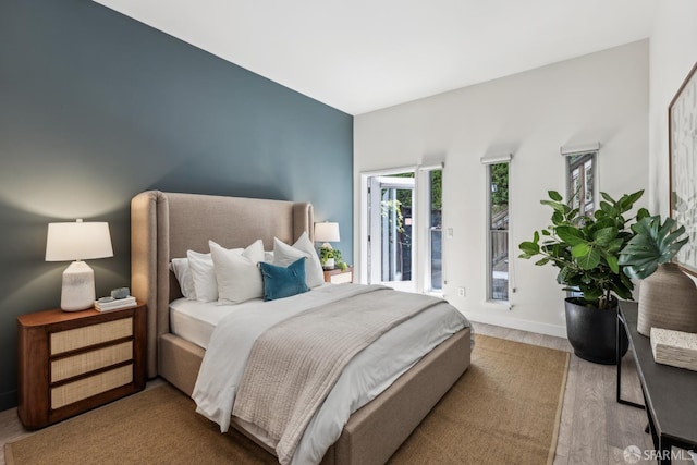 608 Missouri St Unit A, San Francisco, CA 94107 - bedroom with wood finished floors, access to outside, and baseboards