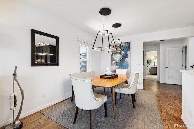 2464 Alida St, Oakland, CA 95602 - dining area with a chandelier and wood finished floors