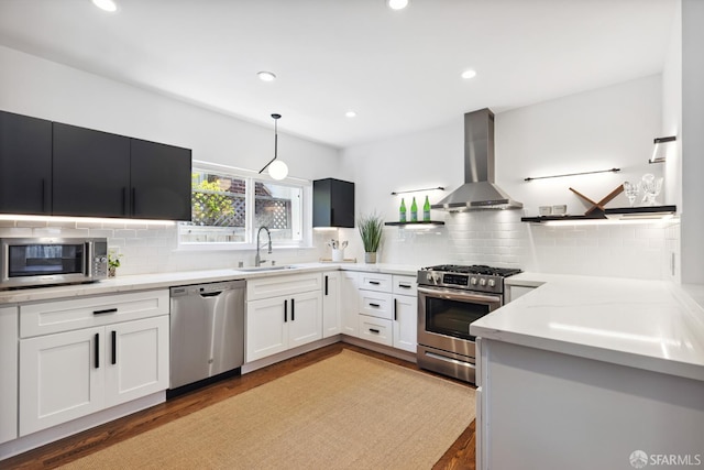 2464 Alida St, Oakland, CA 95602 - kitchen with appliances with stainless steel finishes, wall chimney range hood, open shelves, tasteful backsplash, and recessed lighting