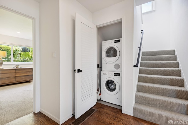 2464 Alida St, Oakland, CA 95602 - washroom with stacked washer and clothes dryer and wood finished floors