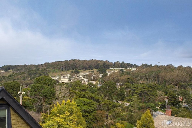 exterior space featuring a view of trees