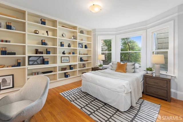 bedroom with light wood finished floors