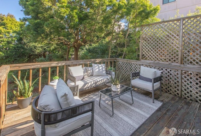 wooden deck featuring an outdoor living space