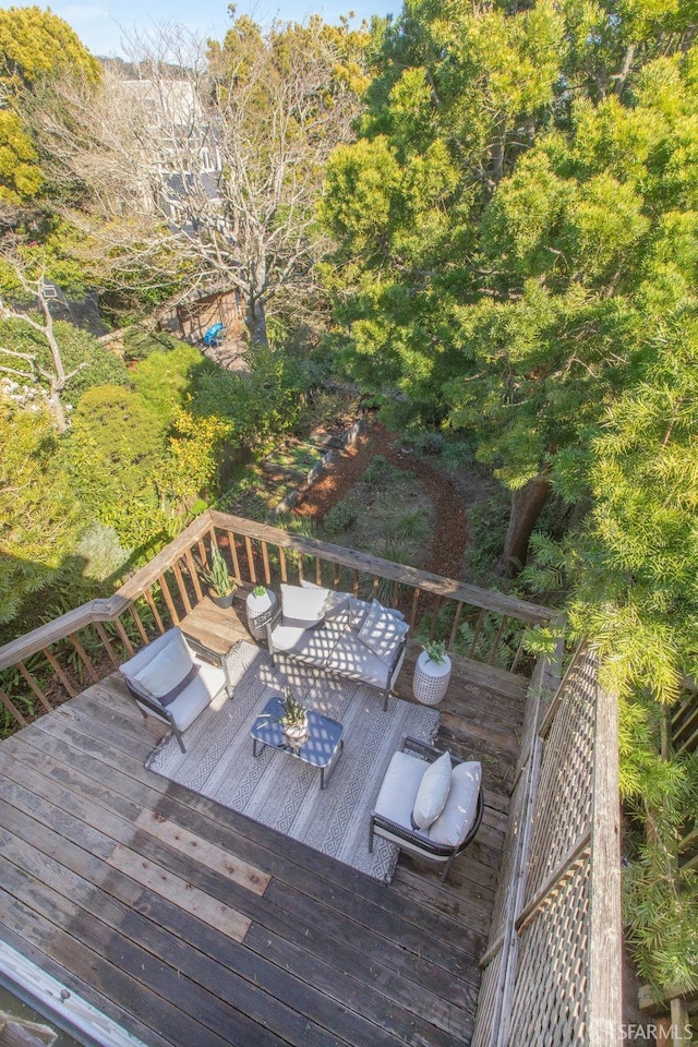 wooden terrace with outdoor dining area