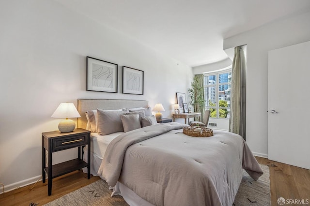 bedroom with hardwood / wood-style floors