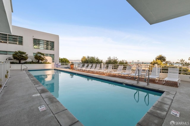 view of swimming pool with a patio