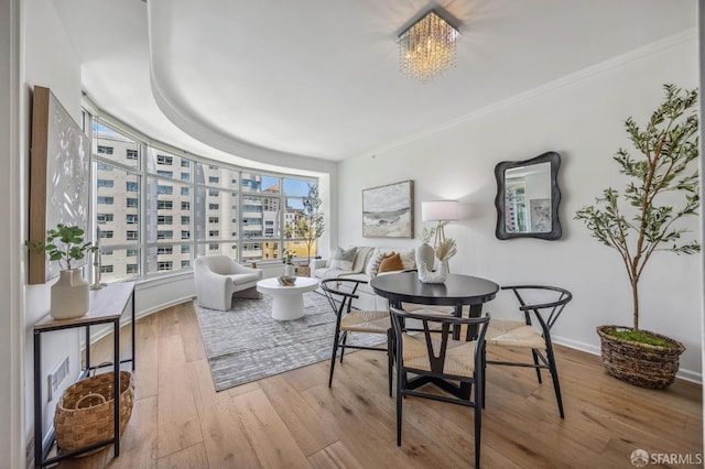 interior space with an inviting chandelier and hardwood / wood-style flooring