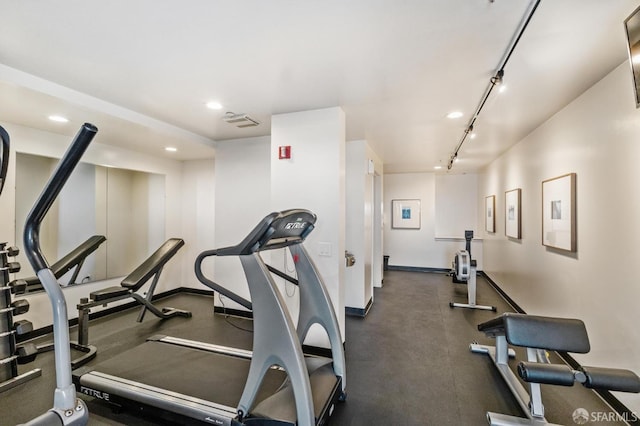 workout area with track lighting