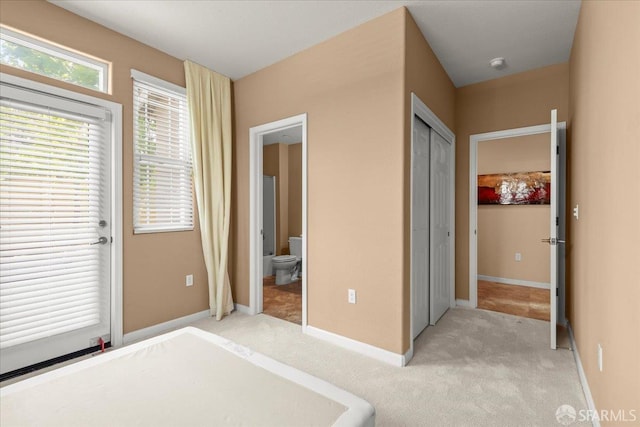 41008 Asilomar Ter, Fremont, CA 94538 - unfurnished bedroom with light colored carpet, connected bathroom, baseboards, and a closet