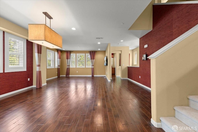 41008 Asilomar Ter, Fremont, CA 94538 - unfurnished living room with baseboards, dark wood-type flooring, and stairs