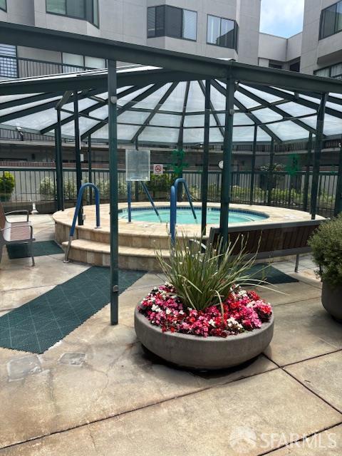 601 Van Ness Ave Unit 1102, San Francisco, CA 94102 - surrounding community featuring a pool, a fenced backyard, and a patio area