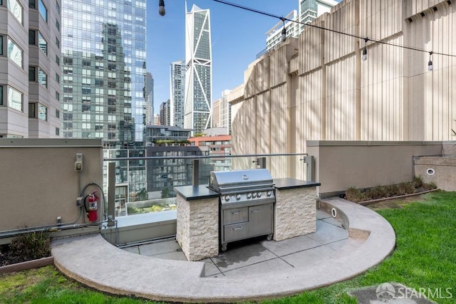 view of patio with area for grilling and exterior kitchen