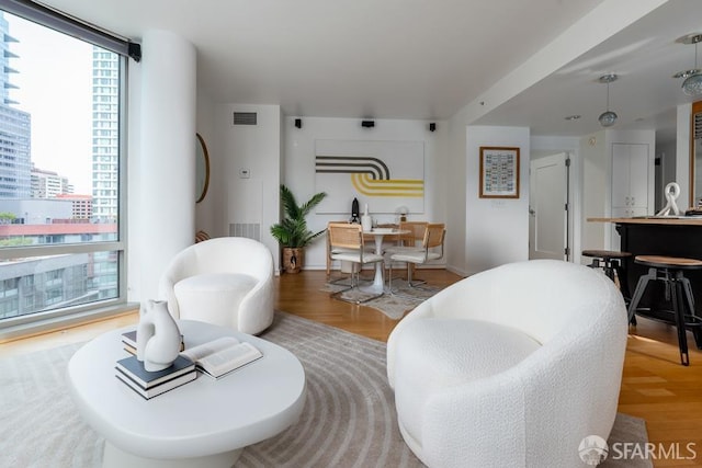 living room with light hardwood / wood-style floors