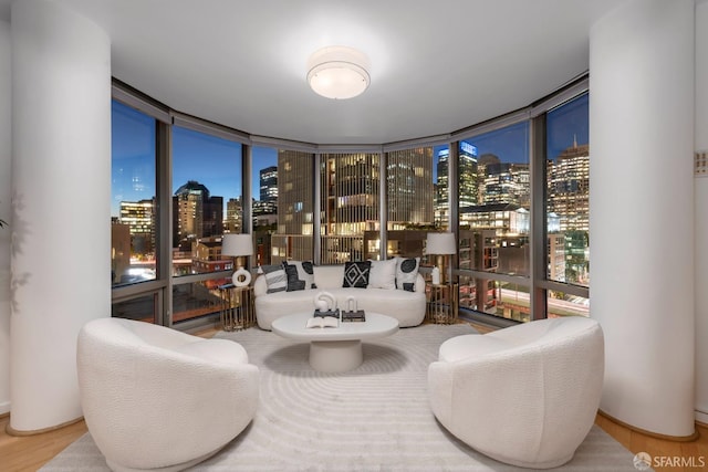 interior space featuring hardwood / wood-style flooring and floor to ceiling windows