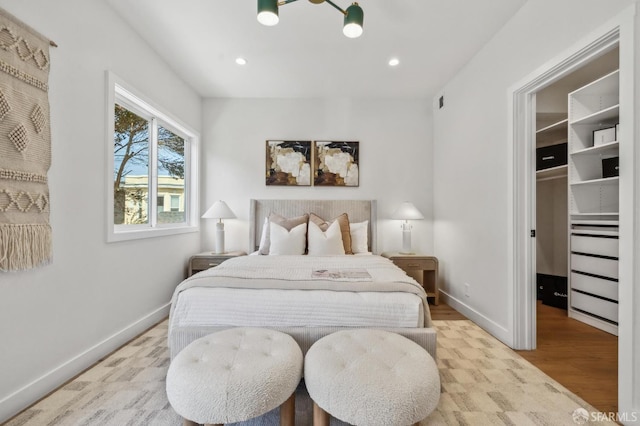 57 Niagara Ave, San Francisco, CA 94112 - bedroom featuring a walk in closet, wood finished floors, and recessed lighting