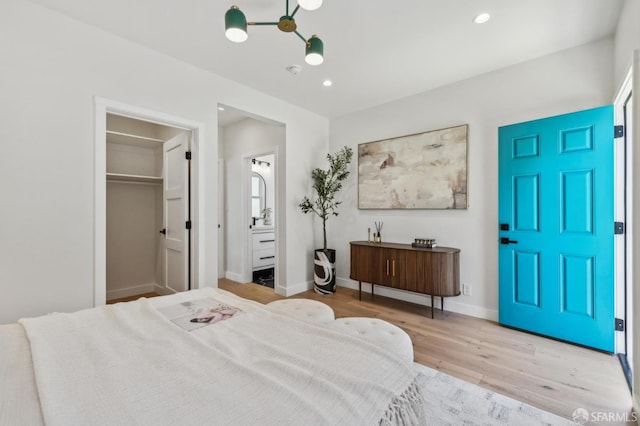 57 Niagara Ave, San Francisco, CA 94112 - bedroom featuring wood finished floors, recessed lighting, a walk in closet, and ensuite bathroom